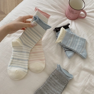 Striped cotton crew socks in macaron colors with rolled cuffs for a cozy lifestyle look