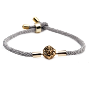 Adjustable gray braided Milan rope bracelet featuring a golden lion head metal charm