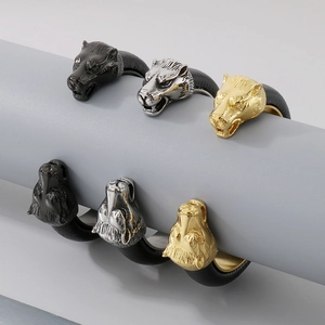 Detailed view of punk wolf head bracelets in black, silver, and gold leather styles