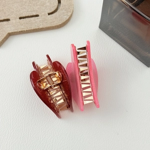 Sparkly candy color heart-shaped hair claws in red and pink with gold metal clips