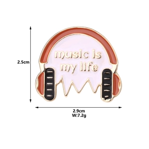 Detail view of headphone enamel brooch with 'Music is My Life' text and dimensions