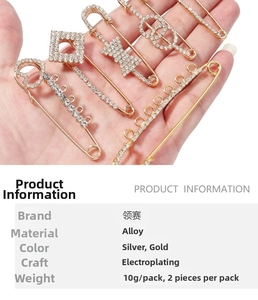 Detail view of heart and bow crystal U-shaped pins with gold alloy plating finish