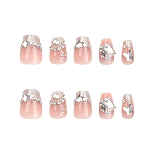 French nude pink press-on nails with silver glitter, rhinestones and 3D metal butterfly