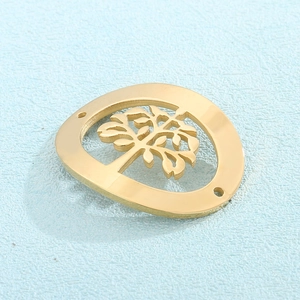 Macro detail of golden hollow life tree pendant with polished stainless steel finish