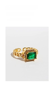 Detail of vintage gold chain ring with square emerald zircon and sparkling crystal pave