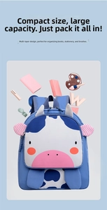 Linda mochila de vaca azul para niños con útiles escolares y gran capacidad, detalle
