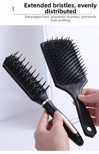 Detail of professional hairbrush set with long bristles and rose gold ring accents