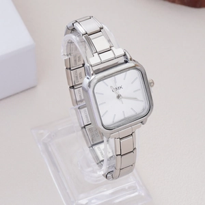 Elegant silver square quartz watch with rhinestone stretch bracelet on display stand