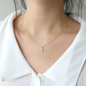 Minimalist S925 sterling silver marquise zircon necklace shown on a model's neck