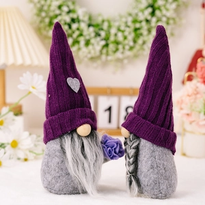Pair of purple knitted hat gnomes with grey felt bodies and floral decor