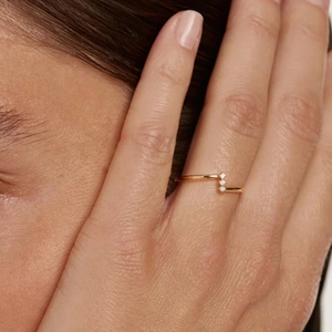 Minimalist S925 silver gold-plated ring with three vertical zircons shown on model