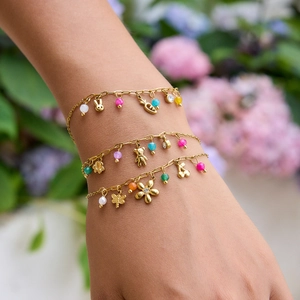 Three-piece gold plated flower bracelet set with animal charms and colorful beads