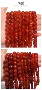 Detailed view of natural red agate round beads in various sizes for DIY jewelry making