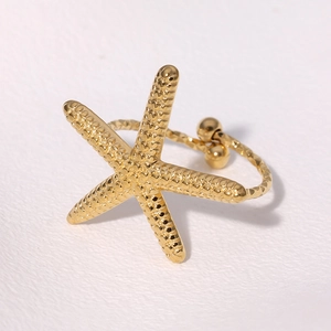 Polished gold starfish ring with textured band and adjustable open design for women
