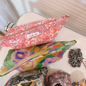 Floral cotton makeup bags with various patterns and top zipper closure
