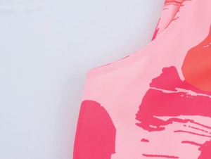 Detailed view of pink tie-dye chiffon dress fabric with high-quality double-stitched seams