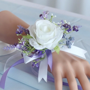 White artificial rose wrist corsage with lavender accents and long satin ribbons