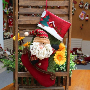 Christmas stocking with 3D Santa on sleigh, festive plush red and green holiday decor