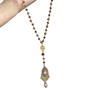 Vintage necklace with tiger eye beads, gold floral knot, and gemstone pendant detail
