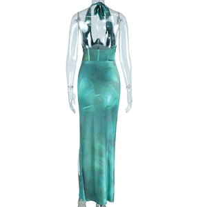 Detail of emerald green marble print dress showing halter back and cutout design