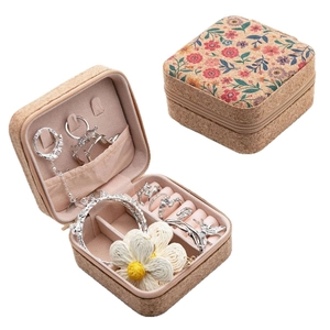 Portable mini jewelry box with cork texture and floral print in open and closed views