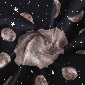 Detailed view of bohemian moon phase tapestry with starry print and metallic mesh texture