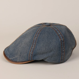 Close-up of navy denim ivy cap featuring brown contrast piping and vintage stitching