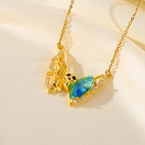 Titanium steel gold butterfly necklace featuring teal gemstone and sparkling rhinestones