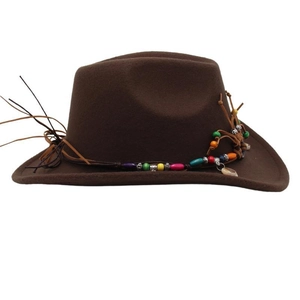 Detail of dark brown western cowboy hat with colorful beads, leather cord and shell pendant