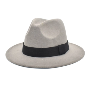 Detail of grey wool fedora hat featuring a classic black grosgrain ribbon band decoration