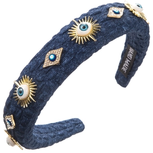 Close-up of handmade denim headband with golden evil eye charms and sparkling rhinestones
