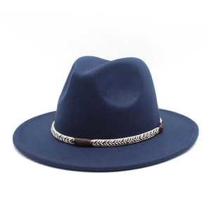 Detail of navy blue wool fedora hat featuring a vintage woven band and wide brim