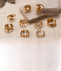 Detailed close-up of 9-piece gold titanium steel ring set with snake and leaf designs