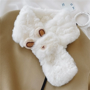 Detail of white faux fur scarf featuring a cute animal head design with brown ears
