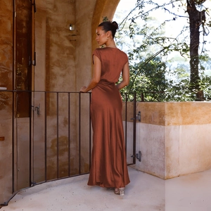 Elegant satin V-neck mermaid dress in rust brown with silky texture and backless detail
