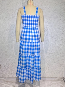 Back view of a blue and white checkered summer maxi dress with tiered ruffle hem design