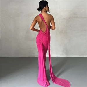 Detailed back view of a backless magenta evening dress with elegant ruching and long train