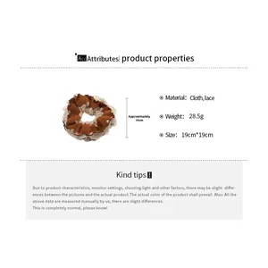 Lace scrunchie detail showing dimensions of approx 19cm and weight of 28.5g in cloth