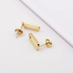 Minimalist gold hollow oval geometric stud earrings in stainless steel on white background