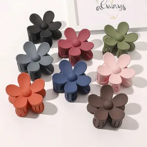 Matte floral claw clips in candy colors including burgundy, olive, and navy blue
