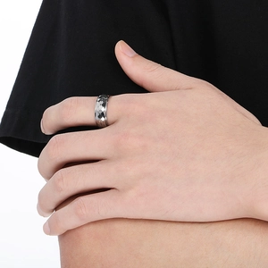 Detail view of silver hammered texture titanium steel ring for men in industrial style