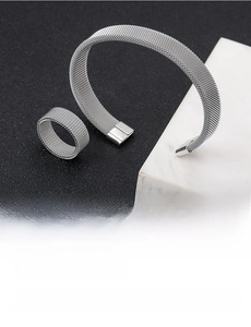 Detail of silver mesh texture on adjustable stainless steel bracelet and ring set