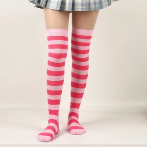 Detailed shot of pink striped over-knee socks styled with a plaid skirt for JK look