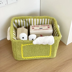 Detail of green plush storage basket showing soft lamb wool texture and striped lining