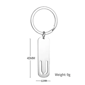 Polished stainless steel letter rectangular bar keychain with cutout design and round ring