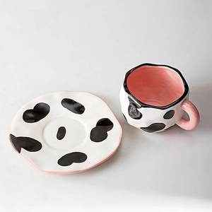 Irregular handmade ceramic coffee cup and saucer set with black and white cow pattern