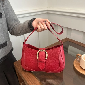 Chic red litchi texture shoulder bag with golden horseshoe buckle for women's daily commute