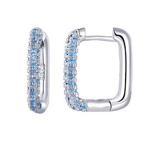 Detailed macro view of S925 sterling silver hoop earrings with light blue zircon stones