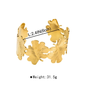 Macro view showing 2.4 inch polished gold metal leaf textured bangle dimensions