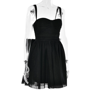 Detail view of black mini dress featuring a sweetheart neckline and ruffled tulle skirt